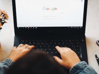 person using black laptop computer